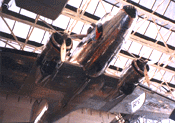 A Douglas DC3 airplane hanging from the ceiling of the National Air and Space Museum.