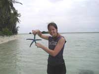 Haley finds a starfish in the coral filled seas.