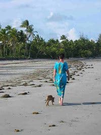 Pangani, On Tanzania's Coast: Worth Finding! 5 The author walking the beach in Pangani Tanzania with her dog. photos by John Parkin and Terry Harnwell.
