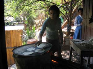 Honduran Corn Tortillas 1 Cooking tortillas, in the Honduran tradition.