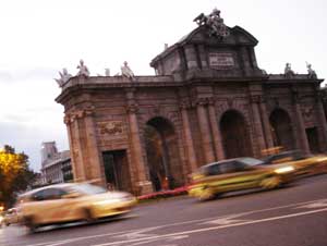 Puerta Alcala sits in the middle of a traffic circle in Madrid. Its commemerative arches signify one of the five ancient entrances to the city. 