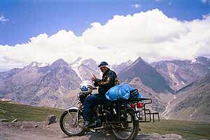 biker-with-himalayas-as-bac