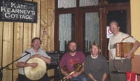 The author is shown with Daniel Moroney, Barry Lyndh and Mike Dowd of the band Tua Tha at Kate Kearney's cottage in the Gap of Dunloe.