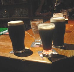Learning to pour a pint of Guiness is part of the experience.