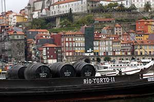 Historical boats on the River Douro show how Porto's famed port wine was transported down from the hills.