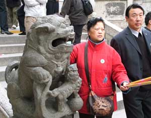 Miraculous Macau: Modern and Mystifying 7 One of the stone lions guarding the temple