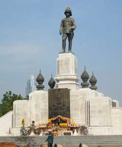 King Rama VI stands sentinel above his memorial. Rama VI ruled Thailand from 1911 - to his death in 1925. In 1925 he donated this land to be used as a public park and fairground.
