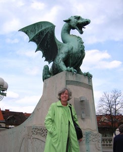 The author at Dragon Bridge -- The dragons crowning the bridge are the symbol of Ljubljana. photo by Susan McKee, susanmckee.com
