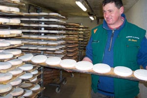 The French Alps: Snowplowing My Way Through 6 A young farmer proudly displays his newest crop of Reblochon cheese, used in several regional dishes.