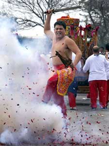 A sword-wielding dancer at the Tienhou Temple