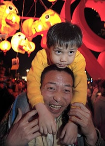 A father and his son enjoy the festival in Kaohsing.