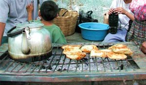 Lake Atitlan, Guatemala: Mayan Culture Tourism 7 "Chuchos" are made of corn meal with a bit of meat and gravy.