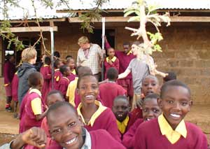 Volunteering in Kenya: From the Safari to the Relief Station 2 Mark Jenner (center) visits a school in Kenya.