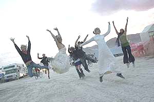 What is Burning Man and Why Should You Go? 2 Photo by David Peterman of Jumping Brides at Burning Man 2005