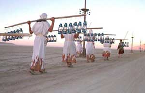 What is Burning Man and Why Should You Go? 4 Lamplighters at Burning Man. photo by Steve Schwartz. ss@mustangdreams.com
