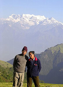 The auithor and her husband are shown with the Himalayas in the background. Photos by Mridula Dwivedi