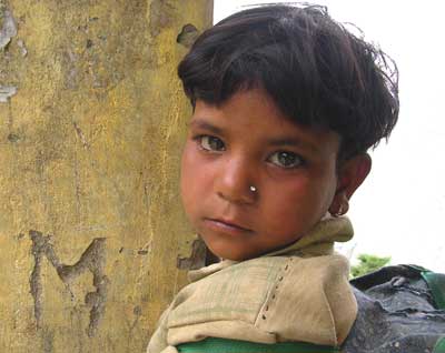 India: A Trek Through the Kuari Pass 10 A youngster waiting for Grandma