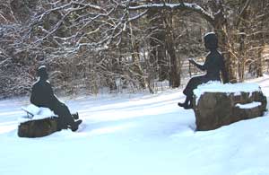 Statutes of Emily Dickinson and Robert Frost in a park in Amherst