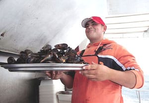 Serving mussels at O Grove