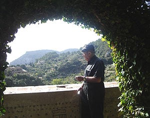 The author is shown at the Cartoixa Reial Monastery in the garden of the Chopin cells.