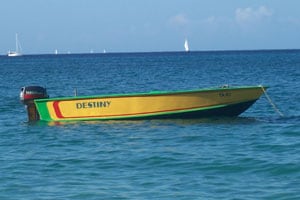 A brightly painted water taxi moored off of Lower Bay Beach.