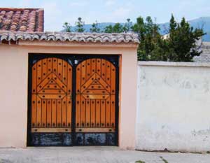 Beyond a Shadow of a Snout: A Saturday in Otavalo, Ecuador 4 Doors like these represent one of the few uses of wood in Otavalo’s architecture.