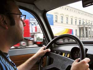 The author drives a 1987 Trabant along the streets of East Berlin as part of the Trabant Safari.