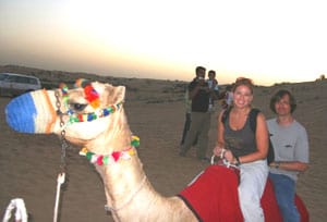 Lisa riding a camel in Dubai