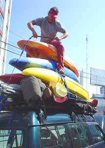 Rafting the Cotahuasi, One Woman's Adventure 3 Loading up gear, raft, and kayaks atop a van in Areqippa, Peru for the 12 hour drive to Cotahuasi