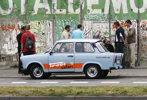 A “Trabi” from Berlin’s Trabant Safari parked alongside The East Side Gallery.
