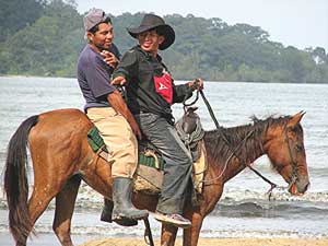 Cowboys on the beach in Panama, Central America.