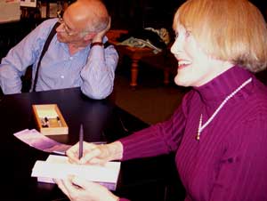 Catherine Watson signs copies of her book.