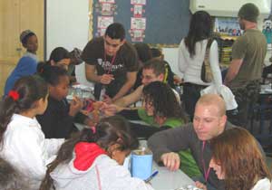 The author, below right, meets with Israeli schoolchildren.
