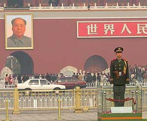 Chairman Mao keeps watch over Tiananmen Square.