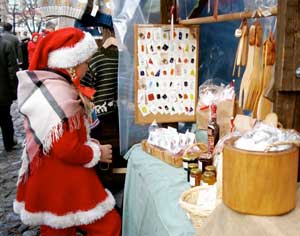 One of Santa's helpers enjoys the Christmas Market shops in Turku.