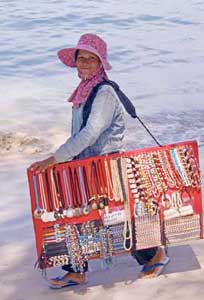 Koh Samui's Fine Beaches, Spicy Food, Mummies 3 Selling necklaces on the beach
