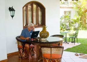 Mexico: Los Gringos in a Beautiful Paradise 2 Barry working on a writing job on the porch of his house in Sayulita