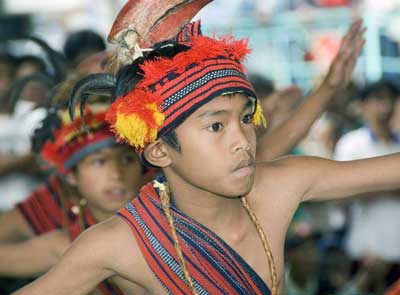 Banaue, Philippines: The Imbayah Festival 9 A young dancer with a hornbill headdress