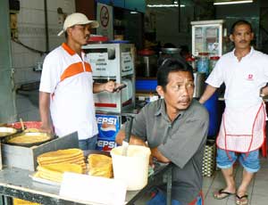 Vendors in a Kuching market
