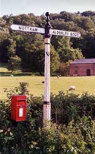 A signpost directs to the town Alderley Edge