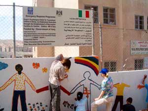 VFP volunteers work with children at a refugee camp in Palestine.