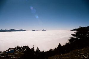 A sea of clouds enveloping everything, as mountain peaks jut out