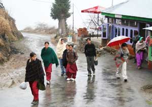 The canteen at Sojha and people walking home in rain
