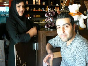 Elham and his sister at their cafe