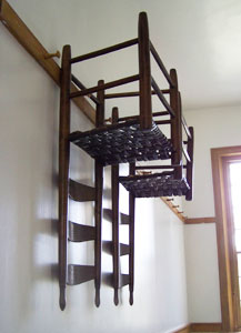 The Shakers didn't like clutter. When possible, items such as chairs, were kept off the floor except when in use. Clothes, hats and other small items were also hung on pegs on room walls.