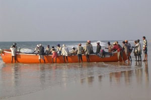 Fishermen launching a boat