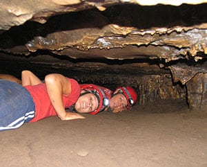 Caving and Quad Biking in Oudtshoorn, South Africa 5 Crawling through a tight space - photo courtesy of Swartberg Adventures