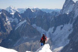 Hiking the narrow trail on the top of Mt Blanc in the French Alps