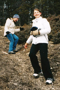 Jasper, Alberta: Winter Fun with the Girls 2 Dawn and Carrie climbing down a hill on the trail behind Jasper