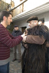 Sardinia's Mamuthones: An Ancient Carnival 5 Pino helping a Mamuthone get dressed